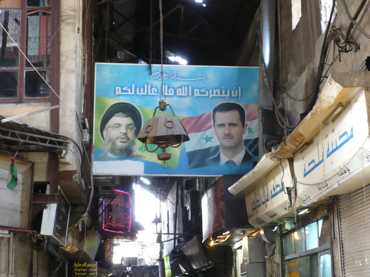 Political poster in a market of then Syrian President Bashar al-Assad and then Hezbollah leader Hassan Nasrallah of Lebanon